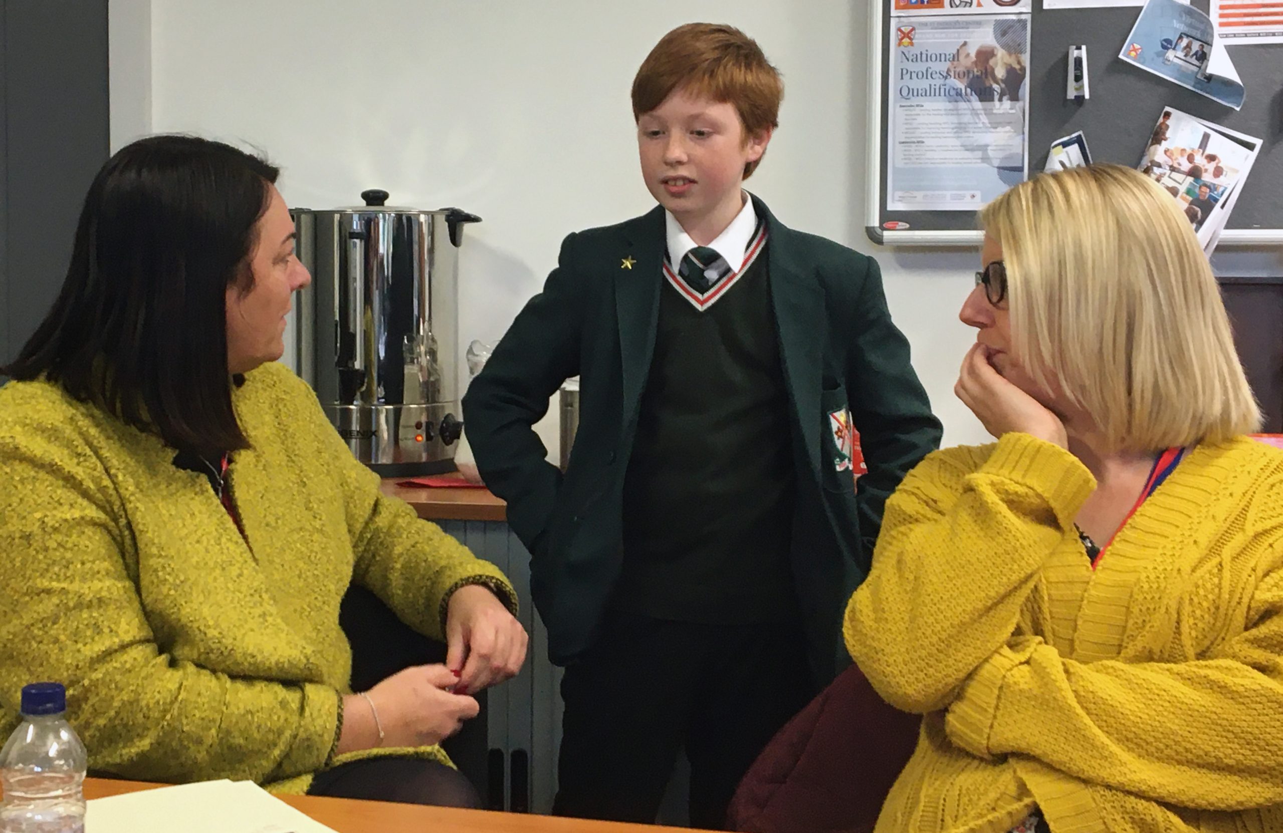 Primary teachers talking to a student at St Patrick's